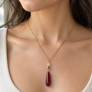 Adele necklace with faceted rose red and blush stones and a gold-coloured hematite bead