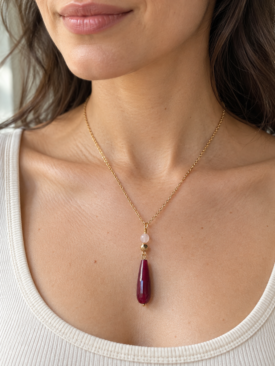 Adele necklace with faceted rose red and blush stones and a gold-coloured hematite bead