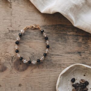 Nora bracelet with black and transparent crystals and gold spacer beads